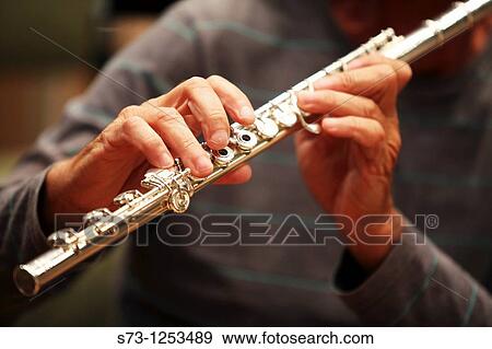 Man playing flute View Large Photo Image Stock Photo - Man playing flute. Fotosearch
