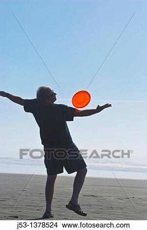 Man playing freestyle frisbee on California beach View Large Photo Image Picture - Man playing freestyle frisbee on California beach. Fotosearch