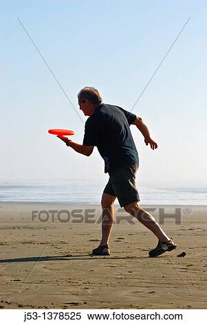 Man playing freestyle frisbee on California beach View Large Photo Image Stock Photography - Man playing freestyle frisbee on California beach. Fotosearch