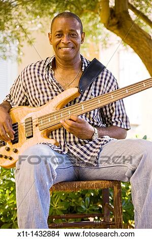 Man playing guitar. View Large Photo Image Picture - Man playing guitar.. Fotosearch