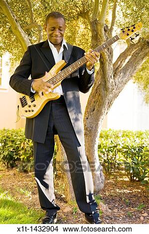 Man playing guitar. View Large Photo Image Picture - Man playing guitar.. Fotosearch