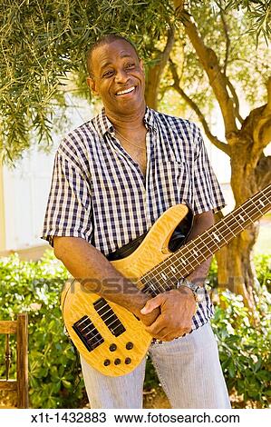 Man playing guitar. View Large Photo Image Stock Image - Man playing guitar.. Fotosearch