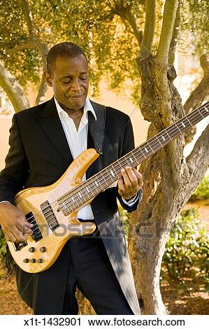 Man playing guitar. View Large Photo Image Stock Image - Man playing guitar.. Fotosearch