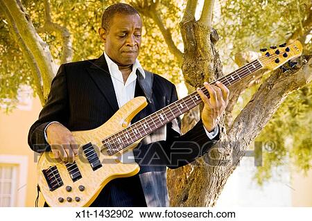 Man playing guitar. View Large Photo Image Stock Image - Man playing guitar.. Fotosearch