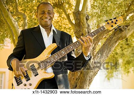 Man playing guitar. View Large Photo Image Stock Image - Man playing guitar.. Fotosearch