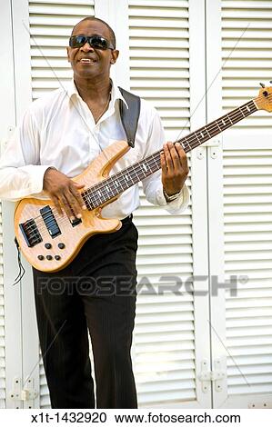 Stock Image - Man playing guitar.. Fotosearch