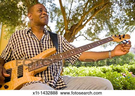 Man playing guitar. View Large Photo Image Stock Photo - Man playing guitar.. Fotosearch