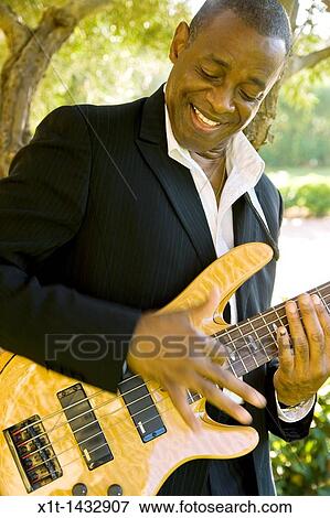 Man playing guitar. View Large Photo Image Stock Photo - Man playing guitar.. Fotosearch