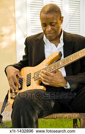 Man playing guitar. View Large Photo Image Stock Photograph - Man playing guitar.. Fotosearch