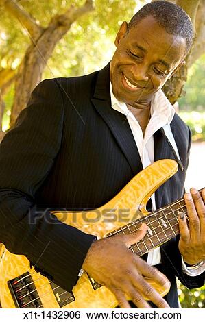 Man playing guitar. View Large Photo Image Stock Photograph - Man playing guitar.. Fotosearch