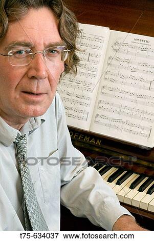 Man playing the piano View Large Photo Image Stock Photo - Man playing the piano. Fotosearch
