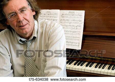 Stock Photo - Man playing the piano. Fotosearch