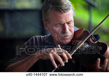 Man playing the Violin View Large Photo Image Stock Photo - Man playing the Violin. Fotosearch