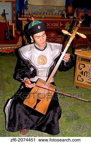 Man Playing Traditional Horsehead Fiddle Music in Ulaan Baatar Mongolia. View Large Photo Image Stock Image - Man Playing Traditional Horsehead Fiddle Music in Ulaan Baatar Mongolia.. Fotosearch