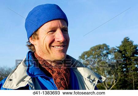 man portrait middle aged blue hat View Large Photo Image Stock Image - man portrait middle aged blue hat. Fotosearch