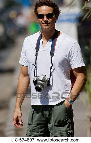 man posing with camera View Large Photo Image Stock Photo - man posing with camera. Fotosearch