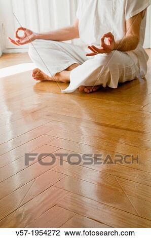 Man practicing yoga, sitting in the lotus position. View Large Photo Image Stock Image - Man practicing yoga, sitting in the lotus position.. Fotosearch
