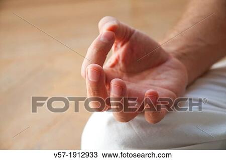 Man practising yoga, sitting in the lotus position. Close view. View Large Photo Image Stock Image - Man practising yoga, sitting in the lotus position. Close view.. Fotosearch