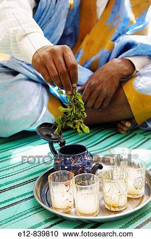 Man preparing tea, Chinguetti. Adrar Plateau, Sahara Desert, Mauritania View Large Photo Image Stock Image - Man preparing tea, Chinguetti. Adrar Plateau, Sahara Desert, Mauritania. Fotosearch