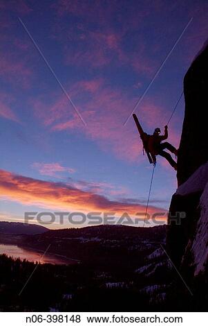 Man rappelling during small avalanche with skis on his back on Donner Summit, California. USA View Large Photo Image Stock Photo - Man rappelling during small avalanche with skis on his back on Donner Summit, California. USA. Fotosearch