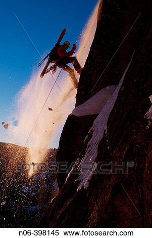 Man rappelling during small avalanche with skis on his back on Donner Summit, California. USA View Large Photo Image Stock Photography - Man rappelling during small avalanche with skis on his back on Donner Summit, California. USA. Fotosearch