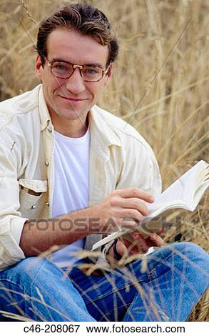 Stock Photo - Man reading a book. Fotosearch