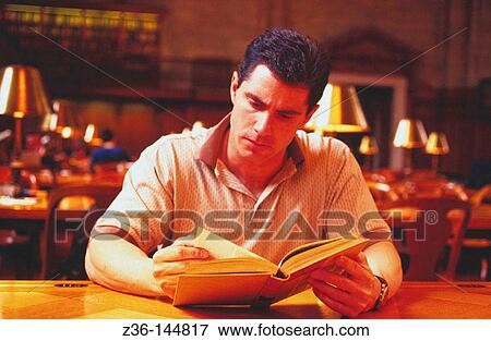 Stock Photo - Man reading a book. Fotosearch