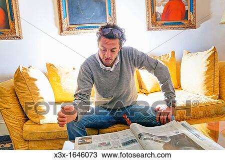 Man reading a newspaper View Large Photo Image Stock Image - Man reading a newspaper. Fotosearch