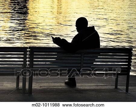 Man reading in Port Vell, Catalonia, Spain View Large Photo Image Stock Photo - Man reading in Port Vell, Catalonia, Spain. Fotosearch