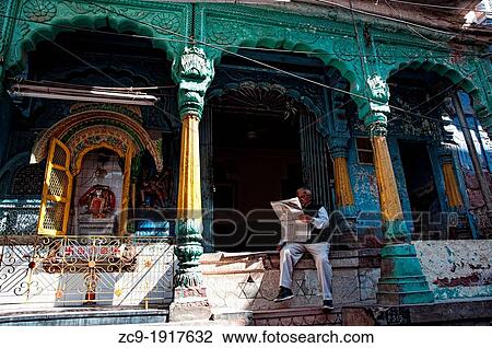 Man reading newspaper and sitting in front of a temple Jodhpur, Rajasthan, india View Large Photo Image Stock Image - Man reading newspaper and sitting in front of a temple Jodhpur, Rajasthan, india. Fotosearch