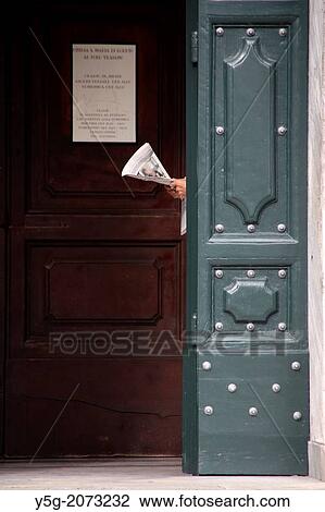 man reading newspaper in church door in rome italy. View Large Photo Image Stock Image - man reading newspaper in church door in rome italy.. Fotosearch