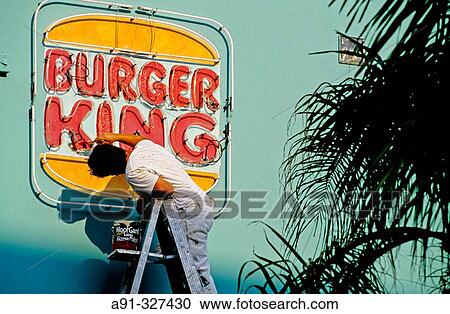 Man repainting a Burger King fast food restaurant facade in the Art Deco district, Miami Beach, Florida. USA. View Large Photo Image Stock Image - Man repainting a Burger King fast food restaurant facade in the Art Deco district, Miami Beach, Florida. USA.. Fotosearch