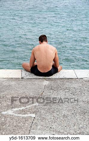 man resting at Paquis Plage, Geneva Lake, Geneva, Switzerland View Large Photo Image Stock Photo - man resting at Paquis Plage, Geneva Lake, Geneva, Switzerland. Fotosearch