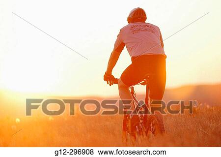 Man riding mountain bike in foothills. Boise, Idaho. USA View Large Photo Image Stock Photo - Man riding mountain bike in foothills. Boise, Idaho. USA. Fotosearch