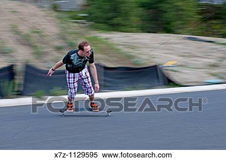 Man riding the Longboard in Spokane Washington View Large Photo Image Stock Photography - Man riding the Longboard in Spokane Washington. Fotosearch