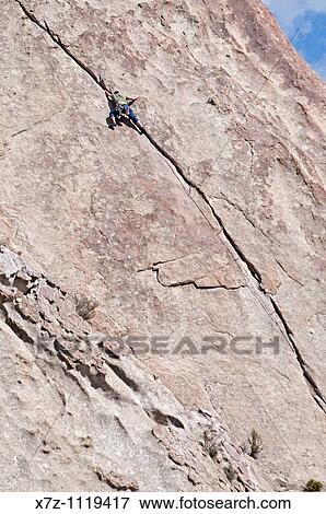 Man rock climbing a route called El Castletan which is rated 5, 10 and located on Castle Rock at Castle Rocks State Park near the town of Almo in southern Idaho View Large Photo Image Stock Photo - Man rock climbing a route called El Castletan which is rated 5, 10 and located on Castle Rock at Castle Rocks State Park near the town of Almo in southern Idaho. Fotosearch