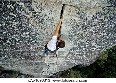Man rock climbing a route called Bishop's Terrace which is rated 5, 8 and located at Church Bowl in Yosemite Valley at Yosemite National Park in California USA View Large Photo Image Stock Image - Man rock climbing a route called Bishop's Terrace which is rated 5, 8 and located at Church Bowl in Yosemite Valley at Yosemite National Park in California USA. Fotosearch