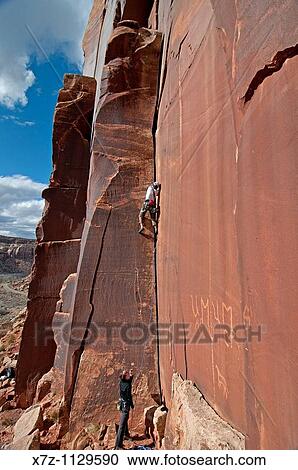 Man rock climbing a route called Amaretto Corner on Super Crack Buttress at Indian Creek Canyon in southern Utah View Large Photo Image Stock Image - Man rock climbing a route called Amaretto Corner on Super Crack Buttress at Indian Creek Canyon in southern Utah. Fotosearch
