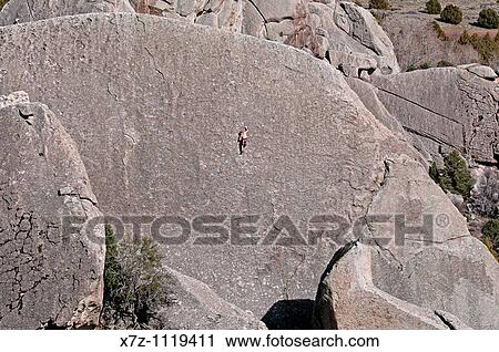 Stock Image - Man rock climbing a route called Taco Right which is rated 5, 9 on The Taco at Castle Rocks State Park near the town of Almo in southern Idaho. Fotosearch