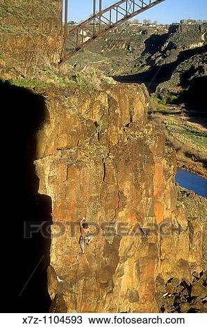 Man, rock climbing an unnamed route at The Bridgeview Crag in the Snake River Canyon near the city of Twin Falls in southern Idaho View Large Photo Image Stock Image - Man, rock climbing an unnamed route at The Bridgeview Crag in the Snake River Canyon near the city of Twin Falls in southern Idaho. Fotosearch