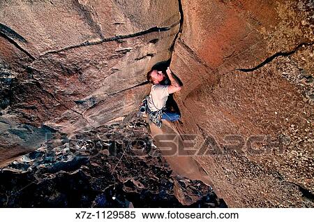 Man rock climbing Big Dude on The Tall Cliffs at Dierkes Lake Park near the city of Twin Falls in the Snake River Canyon of southern Idaho View Large Photo Image Stock Photography - Man rock climbing Big Dude on The Tall Cliffs at Dierkes Lake Park near the city of Twin Falls in the Snake River Canyon of southern Idaho. Fotosearch