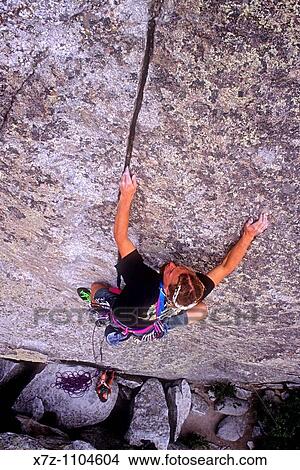 Man, rock climbing Intruding Dike on Super Hits Wall at The City Of Rocks National Reserve near Almo, Idaho View Large Photo Image Picture - Man, rock climbing Intruding Dike on Super Hits Wall at The City Of Rocks National Reserve near Almo, Idaho. Fotosearch