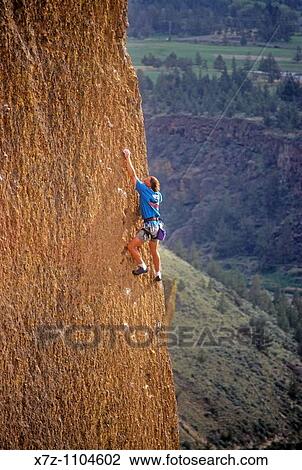 Man, rock climbing Moons Of Pluto high above The Crooked River at Smith Rock State Park, Oregon View Large Photo Image Stock Image - Man, rock climbing Moons Of Pluto high above The Crooked River at Smith Rock State Park, Oregon. Fotosearch