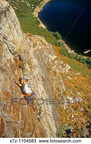 Man, rock climbing the first pitch of Angel Toes on the Angel Lake Crag at Angel Lake high in the East Homboldt Mountains of northern Nevada View Large Photo Image Stock Image - Man, rock climbing the first pitch of Angel Toes on the Angel Lake Crag at Angel Lake high in the East Homboldt Mountains of northern Nevada. Fotosearch