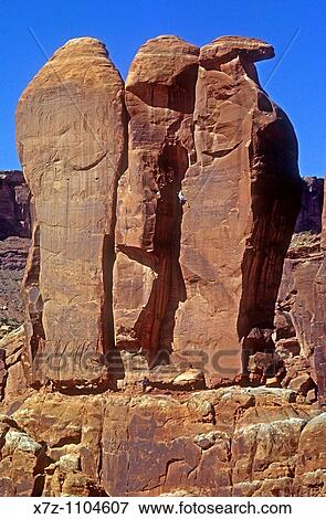 Man, rock climbing the Right Chimney on The Three Penguins in Arches National Park, Moab, Utah View Large Photo Image Stock Photo - Man, rock climbing the Right Chimney on The Three Penguins in Arches National Park, Moab, Utah. Fotosearch
