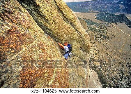 Man, rock climbing The South Buttress route high on Steinfells Dome in The City Of Rocks National Reserve near the town of Almo, Idaho View Large Photo Image Stock Photography - Man, rock climbing The South Buttress route high on Steinfells Dome in The City Of Rocks National Reserve near the town of Almo, Idaho. Fotosearch