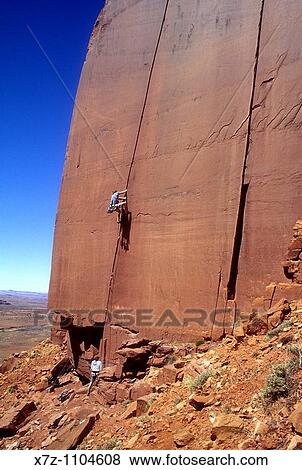 Man, rock climbing The Wiggins 1 route on the Cliffs Of Insanity in Indian Creek Canyon, Utah View Large Photo Image Stock Photo - Man, rock climbing The Wiggins 1 route on the Cliffs Of Insanity in Indian Creek Canyon, Utah. Fotosearch