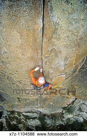 Man, rock climbing Thin Slice on Parkinglot Rock at The City Of Rocks National Reserve near the town of Almo in southern Idaho View Large Photo Image Stock Photo - Man, rock climbing Thin Slice on Parkinglot Rock at The City Of Rocks National Reserve near the town of Almo in southern Idaho. Fotosearch