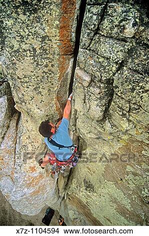 Man, rock climbing Twin Cracks on King On The Throne at City Of Rocks National Reserve near the town of Almo, Idaho View Large Photo Image Picture - Man, rock climbing Twin Cracks on King On The Throne at City Of Rocks National Reserve near the town of Almo, Idaho. Fotosearch