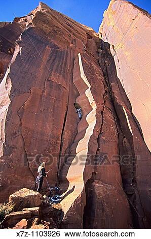 Man, rock climbing Wavy Gravy on the Scarface Wall in Indian Creek Canyon near the town of Moab in southern Utah View Large Photo Image Stock Photograph - Man, rock climbing Wavy Gravy on the Scarface Wall in Indian Creek Canyon near the town of Moab in southern Utah. Fotosearch